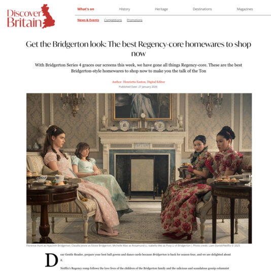 Four women in Regency-era dresses sit elegantly in a lavish, vintage-style drawing room with ornate furniture and decor, evoking the style and atmosphere of the Netflix series Bridgerton.