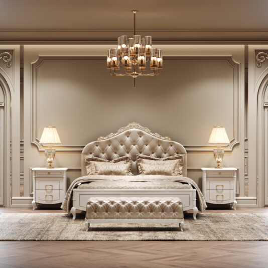 Elegant bedroom featuring a tufted upholstered bed, ornate headboard, matching bench, Classic Style Lacquered Bedside Cabinets with gold lamps, plush rug, and gold chandelier—all in a refined beige and gold palette.