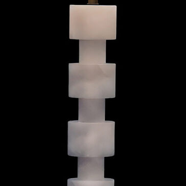 Five frosted, translucent white cubes are stacked vertically to create a striking silhouette against a black background, highlighting the modern elegance of the Round Stacked Table Lamp.