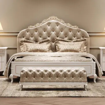 Button Upholstered Bed With Ornate Carvings Luxurious bedroom with an ornate, tufted headboard, matching bedding, and a tufted bench at the foot of the bed. Two bedside tables with lamps flank the bed, all in soft, beige and gold tones.