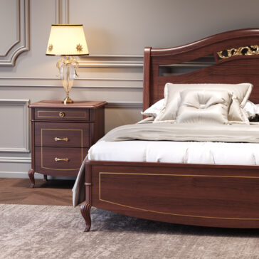A classic wooden bed with gold accents and white bedding stands next to a Classic Style Cherrywood Bedside Cabinet, which is topped with a decorative lamp for an elegant, timeless bedroom look.