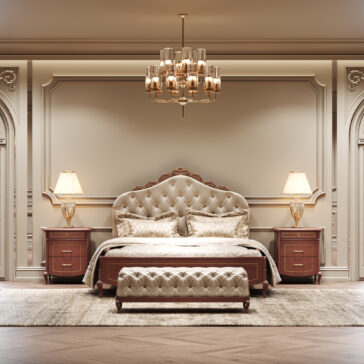 A luxurious bedroom with a tufted headboard, matching ottoman, elegant bedlinen, and a large carpet features two Classic Style Cherrywood Bedside Cabinets beside the bed, both topped with lamps and enhanced by a chandelier in an ornate classic setting.