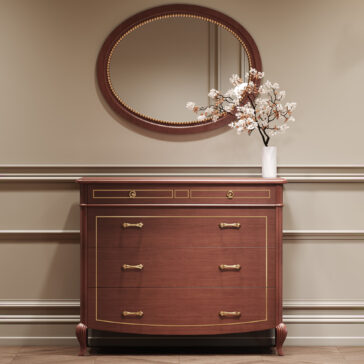 Classic Style Cherrywood Chest Of Drawers The Classic Style Cherrywood Chest of Drawers with gold handles rests against a beige wall with skirting, topped by a white vase with blooming branches. Above it, a round mirror completes the elegant arrangement.