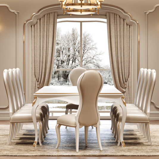 Elegant dining room showcasing the Large White Classic Style Dining Set with eight cream chairs, set before a snowy landscape seen through wide windows with beige curtains, all illuminated by a chandelier above.