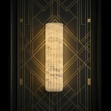 The Luxury Fluted Wall Light features a glowing, textured design and is mounted on a black wall with gold geometric Art Deco patterns.