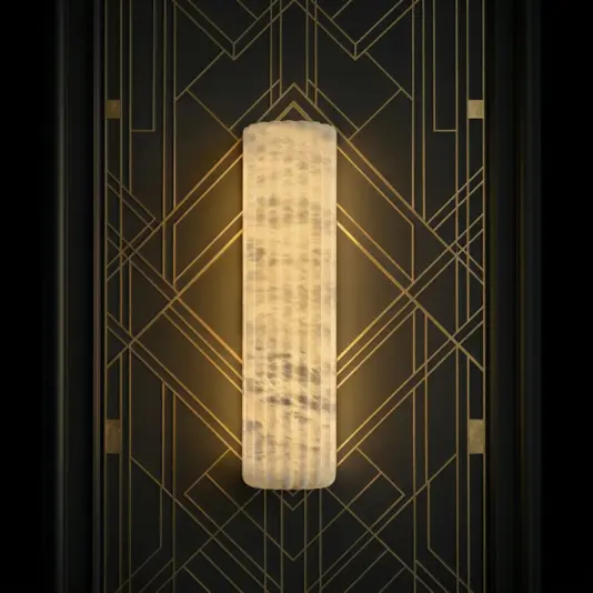 Luxury Fluted Wall Light The Luxury Fluted Wall Light features a glowing, textured design and is mounted on a black wall with gold geometric Art Deco patterns.