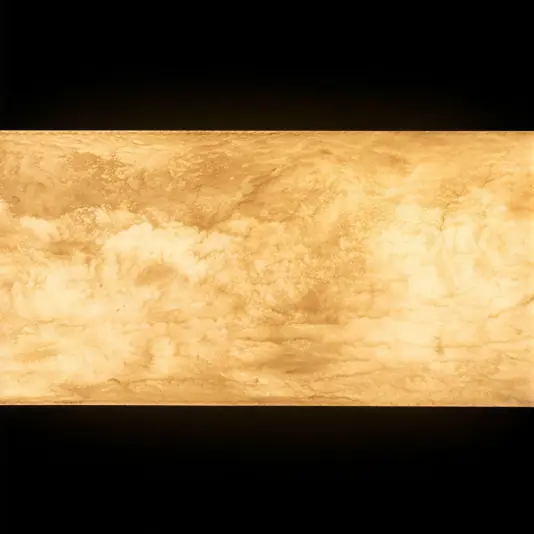 Marbled Tube Wall Light A rectangular panel glows with a warm, golden light, displaying a cloudy, marbled texture against a black background.