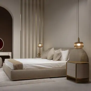 A modern bedroom with a Modern Curved Upholstered Bed, crisp white bedding, neutral pillows, a gold-accented bedside table, two pendant lights, and minimalist décor bathed in soft warm light.