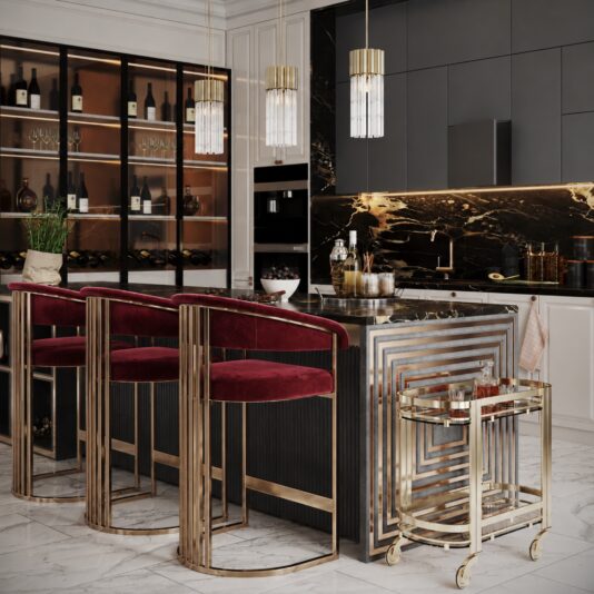 Art Deco Inspired Curved Burgundy Velvet Bar Stool Wide kitchen view with three wine-red velvet stools, brushed metal frames, marble worktops and a gold drinks trolley.
