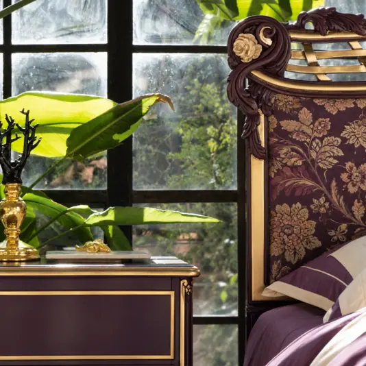 Deep Amethyst Whimsigothic Italian Bed Floral upholstered headboard of a deep amethyst Italian bed with carved frame and gold accents