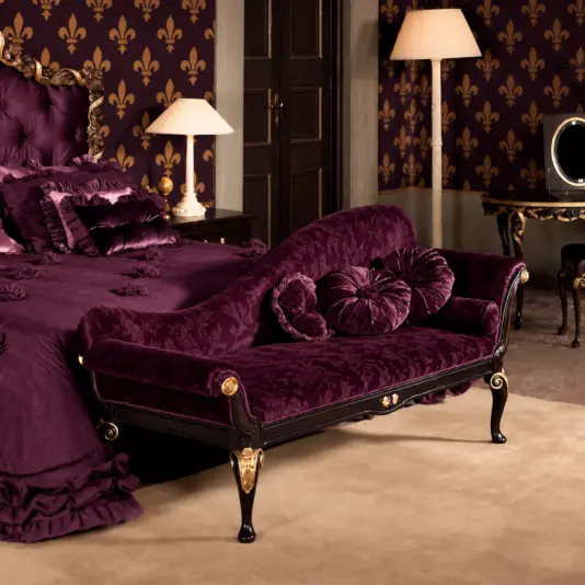 Reproduction whimsygothic Chaise Longue Reproduction whimsygothic chaise longue with plum patterned upholstery and dark wood in a bedroom