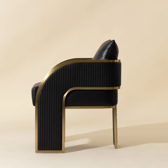 Art Deco Black Faux Leather Dining Chair Side view of black and gold dining armchair with channel-stitched outer arm