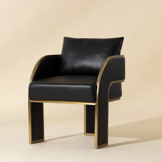 Art Deco Black Faux Leather Dining Chair Angled front view of the black and gold dining chair with sweeping arms and open base