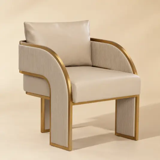 Art Deco Faux Leather Beige Dining Chair Art Deco faux leather beige dining chair with gold frame, viewed from the front
