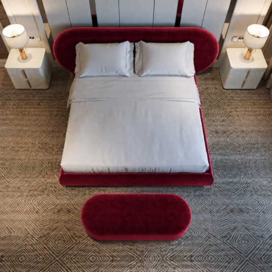 Curved Contemporary Burgundy Velvet Bed Burgundy upholstered bed and matching oval bench viewed from above, with two white bedside cabinets.