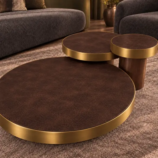 Set Of 3 Brown Leather And Brass Coffee Tables Angled view of three round brown leather coffee tables with matching brass rims and walnut bases.