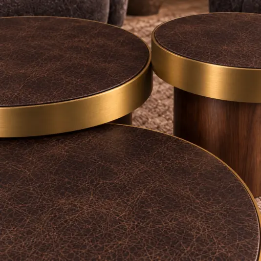 Set Of 3 Brown Leather And Brass Coffee Tables Close-up of distressed chocolate leather, satin metal edging and vertical walnut grain.